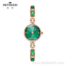 SKYSEED emerald type mother-of-pearl watch